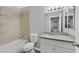 Bathroom with a tiled shower and bath combination, modern vanity, toilet, and a mirror at 230 Mission Newport Ln # 104, Las Vegas, NV 89107