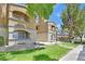 Exterior view of condo building featuring balconies and landscaped grounds at 230 Mission Newport Ln # 104, Las Vegas, NV 89107