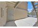 Condo entryway featuring security door, private patio and convenient access at 230 Mission Newport Ln # 104, Las Vegas, NV 89107
