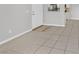 Cozy living space features tiled floor and doorway to the kitchen at 230 Mission Newport Ln # 104, Las Vegas, NV 89107