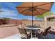 Backyard featuring a covered patio, gravel landscaping, and privacy fencing at 2304 Willow Wren Dr, North Las Vegas, NV 89084