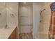 Bathroom featuring a single sink vanity, tile shower, and accessible handrails at 2304 Willow Wren Dr, North Las Vegas, NV 89084