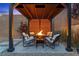 Cozy backyard fire pit area with comfortable seating, perfect for outdoor gatherings and relaxation at 2367 Ridgeline Wash St, Las Vegas, NV 89138
