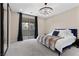 Spacious bedroom with a chandelier, a large bed, and a sliding door to the patio at 2367 Ridgeline Wash St, Las Vegas, NV 89138
