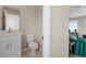 Stylish powder room featuring a white vanity, toilet, and coordinated fixtures at 2367 Ridgeline Wash St, Las Vegas, NV 89138