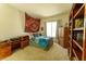 Comfortable bedroom with desk, decorative tapestry, and natural light at 2386 Hardin Ridge Dr, Henderson, NV 89052