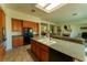 Well-equipped kitchen flows into living area and boasts dark countertops and stainless-steel appliances at 2386 Hardin Ridge Dr, Henderson, NV 89052