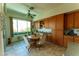 Charming kitchen nook with a round table, chairs, and a window overlooking the landscape at 2386 Hardin Ridge Dr, Henderson, NV 89052