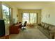 Inviting living room filled with natural light, featuring a desk, comfortable seating, and neutral decor at 2386 Hardin Ridge Dr, Henderson, NV 89052