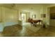 Welcoming living space with tile flooring, a baby grand piano, and natural light at 2386 Hardin Ridge Dr, Henderson, NV 89052