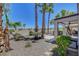 Backyard view featuring desert landscape, mature palm trees and view at 2512 Libretto Ave, Henderson, NV 89052