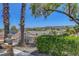 Picturesque backyard featuring desert landscaping, a fountain, and mountain views at 2512 Libretto Ave, Henderson, NV 89052