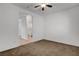 Comfortable bedroom offers neutral carpet, ample space and view to the next room, and bath at 2512 Libretto Ave, Henderson, NV 89052
