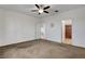 Large bedroom with neutral walls, a ceiling fan, and access to the bathroom and closet at 2512 Libretto Ave, Henderson, NV 89052