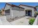 Inviting single-story home with a two-car garage, desert landscaping, and a charming entrance at 2512 Libretto Ave, Henderson, NV 89052