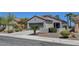 Inviting single-story home boasts a well-maintained front yard and a convenient two-car garage at 2512 Libretto Ave, Henderson, NV 89052