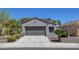 Charming single-story home featuring a two-car garage and desert landscaping at 2512 Libretto Ave, Henderson, NV 89052