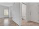 Bright hallway leads to a bathroom and bedroom, showcasing the tile flooring throughout at 2512 Libretto Ave, Henderson, NV 89052