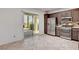 Kitchen equipped with stainless appliances, tile flooring, and access to the patio at 2512 Libretto Ave, Henderson, NV 89052