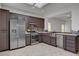 Bright kitchen featuring stainless steel appliances, tile floors, and a skylight at 2512 Libretto Ave, Henderson, NV 89052