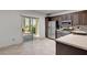 Kitchen featuring tile flooring, stainless appliances, and a glass sliding door at 2512 Libretto Ave, Henderson, NV 89052