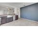 Kitchen featuring tile flooring, stainless appliances, and an open breakfast bar at 2512 Libretto Ave, Henderson, NV 89052