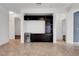 Living room boasting tile floors, built in shelving, and a beverage refrigerator at 2512 Libretto Ave, Henderson, NV 89052