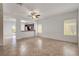 Spacious living room with tile flooring and access to the kitchen and sliding glass door to backyard at 2512 Libretto Ave, Henderson, NV 89052