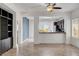 Living room with tile flooring, built in shelving, and a view to the kitchen at 2512 Libretto Ave, Henderson, NV 89052
