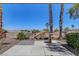 Outdoor patio with mature landscaping and a decorative fountain provides a tranquil setting at 2512 Libretto Ave, Henderson, NV 89052