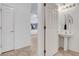 This powder room features a pedestal sink and a decorative mirror with great lighting at 2512 Libretto Ave, Henderson, NV 89052