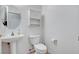 Powder room features a pedestal sink, overhead cabinet and a decorative mirror with great lighting at 2512 Libretto Ave, Henderson, NV 89052