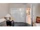 Bedroom featuring sliding closet doors and an open door leading to the primary bathroom at 2801 Byron Dr, Las Vegas, NV 89134