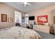 Bedroom featuring neutral walls, ceiling fan, and floral bedding at 2801 Byron Dr, Las Vegas, NV 89134