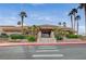 Inviting clubhouse exterior showcasing its well-maintained facade and convenient pedestrian crosswalk at 2801 Byron Dr, Las Vegas, NV 89134