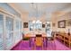 Dining room features a modern chandelier, wooden table, and large window at 2801 Byron Dr, Las Vegas, NV 89134