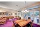 Living and dining room combo with chandelier and sliding door to backyard at 2801 Byron Dr, Las Vegas, NV 89134