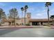 Fitness Center showcases accessible entrance, clock tower, and mature landscaping, creating a welcoming community space at 2801 Byron Dr, Las Vegas, NV 89134