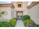Inviting front entrance with wrought iron gate and lush landscaping at 2801 Byron Dr, Las Vegas, NV 89134