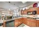 Kitchen featuring wooden cabinets, granite countertops, and stainless steel appliances at 2801 Byron Dr, Las Vegas, NV 89134