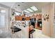 Bright kitchen features wooden cabinets, modern lighting, and breakfast bar with barstools at 2801 Byron Dr, Las Vegas, NV 89134