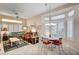 Cozy living room featuring tile floors, a ceiling fan, and comfortable seating at 2801 Byron Dr, Las Vegas, NV 89134