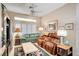 Bright living room with tile floors, a ceiling fan, and comfortable seating at 2801 Byron Dr, Las Vegas, NV 89134