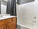 Bathroom featuring a bathtub with tile surround and a wood vanity at 3040 Balcones Fault Ave, North Las Vegas, NV 89081
