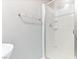 Bright bathroom featuring a walk-in shower with a sliding glass door at 3040 Balcones Fault Ave, North Las Vegas, NV 89081