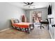 Inviting bedroom features a sliding glass door, a ceiling fan, and plush carpeting for a warm and comfortable feel at 3040 Balcones Fault Ave, North Las Vegas, NV 89081