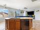 Kitchen featuring oak cabinets, stainless steel appliances, granite countertops, and tile flooring at 3040 Balcones Fault Ave, North Las Vegas, NV 89081