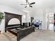 Bedroom with ceiling fan, neutral decor, and ample natural light at 3040 Balcones Fault Ave, North Las Vegas, NV 89081