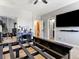 Bedroom with a bed frame, ceiling fan, and ensuite bathroom access at 3040 Balcones Fault Ave, North Las Vegas, NV 89081