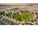 Aerial view of community baseball field with green grass and a covered gazebo at 3088 Paseo Mountain Ave, Henderson, NV 89052